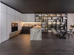 Bookcase and wall unit in integration to the open plan kitchen