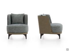 Amanda armchair seen from the front and side, with two-tone upholstery in faux leather and fabric