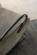 Detail of the curved metallic tube structure, black nickel finish