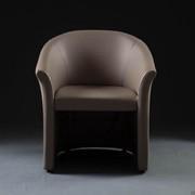 Armchair Free upholstered in faux leather.