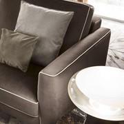 Oakland metal feet upholstered armchair with soft and wide cushions with piping contrasting borders