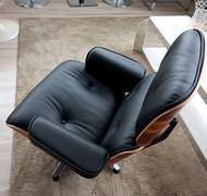 The Eames armchair, a replica inspired by Charles Eames’ design, is available in wood, leather or fabric