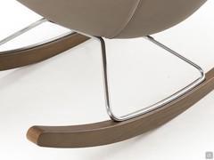 Detail of wooden rocking chair slides with chrome-plated steel frame