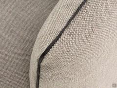 Detail of fabric covering with contrasting faux leather profile