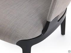 Detail of the charcoal-stained solid ash frame connecting seat and armrests