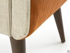 Detail of the seam between the leather upholstery of the shell and the wool-blend fabric seat