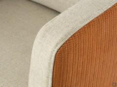 Detail of the upholstery made of printed leather and wool-blend fabric