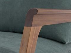 Detail of the curved natural solid walnut armrest for added comfort