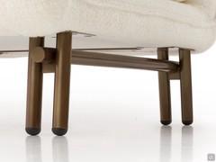 Detail of the front metal frame of the chair Venice, distinguished by a steel tube perpendicular to the feet