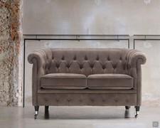 Isadora in the sofa model with 2 seater in tufted leather