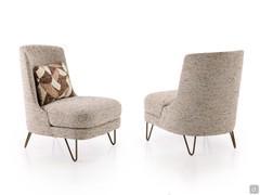 Beatrix armchair with metal hairpin feet, upholstered in the Chanel fabric with a cushion in patterned fabric