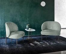 Modern armchair Rakel with metal legs and upholstered seat covered in fabric