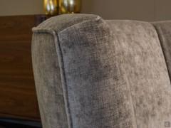 Detail of the high back of the Petra armchair