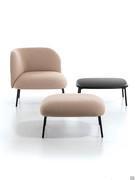 Armchair and ottoman Fortune with slim metal legs that are unobtrusive to the eye