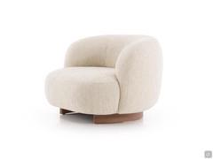 Aralia armchair with generous and enveloping shapes