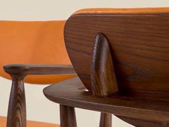 Detail of the armchair back in vintage style, hand-crafted by master artisans as the rest of the wooden structure