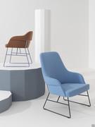 Sophos modern upholstered armchair in the lacquered metal sled leg version combined with the chair from the same collection