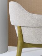 Sophos modern upholstered armchair with beechwood legs and special fabric flap on the backrest