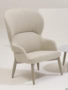 Sophos modern upholstered armchair in bergere version with stained beech legs