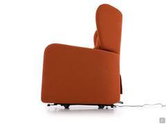 Side view of Viola armchair: the backrest comes with lateral wings and "Kit Roller" system to allow to easily move the armchair thanks to hidden wheels