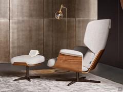 Modern reading armchair Olos Bergère by Bonaldo, characterized by a high, enveloping back and structural elements in curved wood, in two finishes