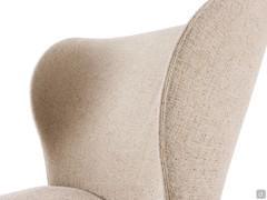 The eye-catching wings of the spacious backrest, distinguishing the Spring armchair