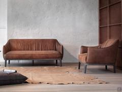 Leather armchair with wooden legs Blossom combined with the sofa of the same name