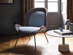 Minimalist armchair with high legs Athena, seat with soft cushions for added comfort