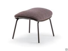 Optional ottoman with the same minimalist design and tall metal legs