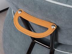 Leather handle detail to make moving the Alice armchair easier