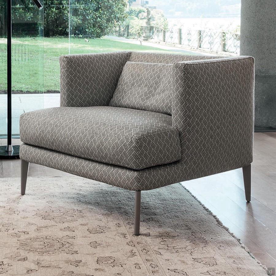 Paraiso stylish upholstered armchair with low backrest and visible feet