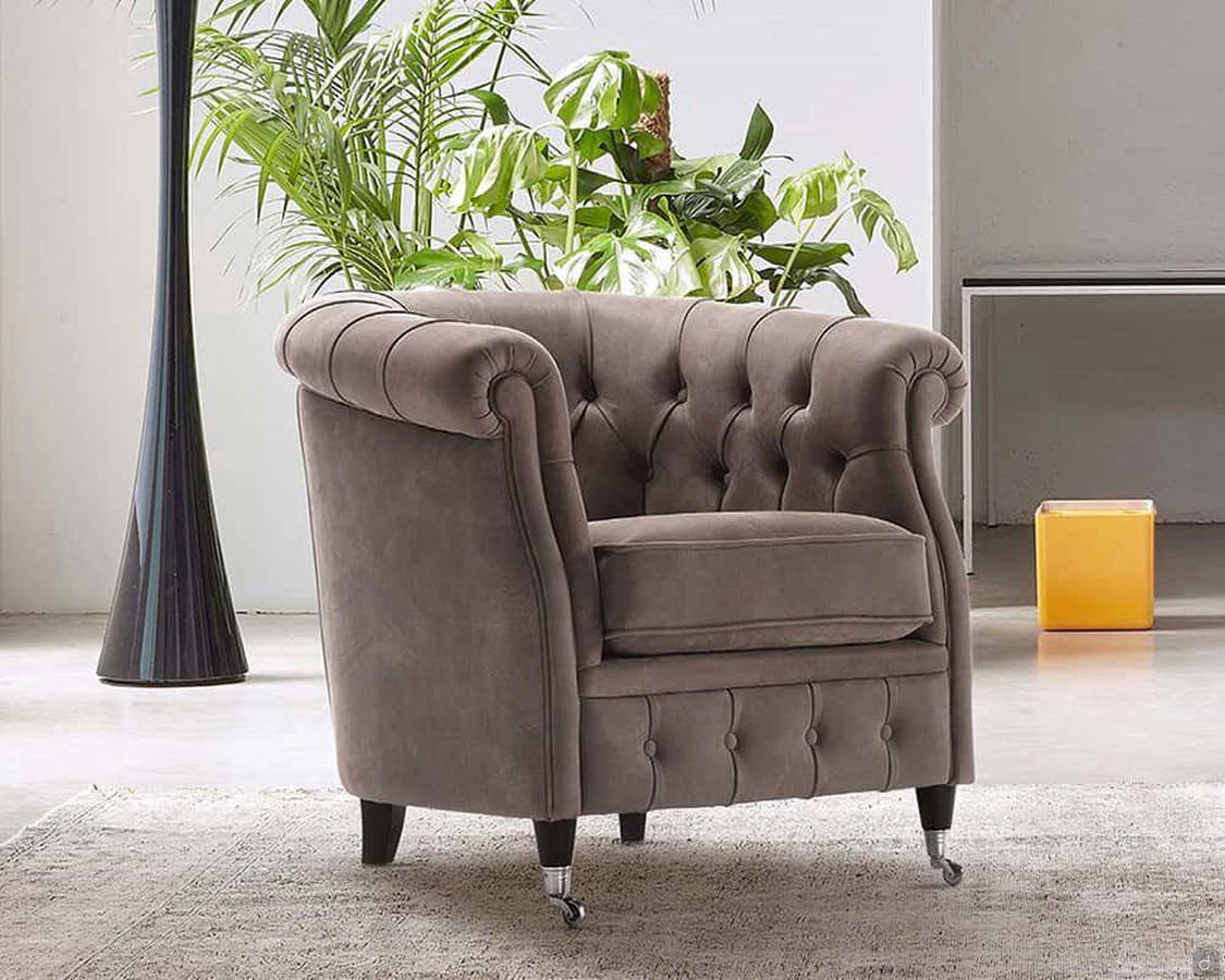 Isadora armchair in a chesterfield style with fixed back feet and frontal feet on casters