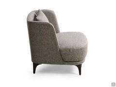 Side view of the Amanda armchair highlighting the absence of armrests and the backrest with side rails