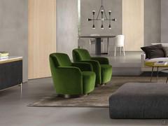 Living room with pair of Yoko swivel armchairs in green velvet and brushed brass base