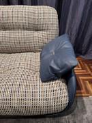 Detail of the optional armrest pad, upholstered in leather to match the armchair shell