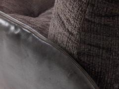 Detail of the combination of the Ghost leather upholstered shell and the Aurora chenille fabric cushions