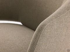 Detail of the enveloping upholstered shell covered in Beat Ringo fabric, one of the many available in the sample book