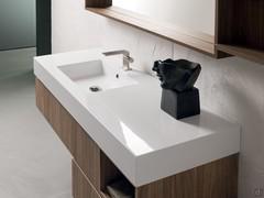 Glossy white mineralguss washbasin resting on the base