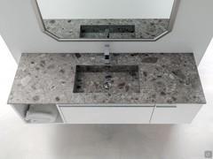 The stoneware top of the N94 Atlantic bathroom cabinet, with integrated bathtub and central mixer tap