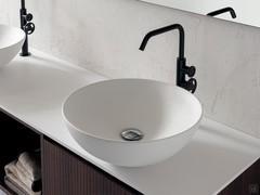 Detail of round Roma model washbasins in matte white ceramic