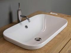 Detail of Movado 58 above-top recessed washbasin in glossy white ceramic