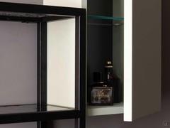 Push-pull opening of the hinged wall unit, equipped with an inner crystal glass shelf