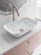 Megha glossy ceramic washbasin resting on Mineralguss top. The two-drawer base unit below is in H5 Datura lacquered Cross melamine