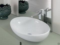 Detail of the Softly countertop allround washbasin in glossy white ceramic