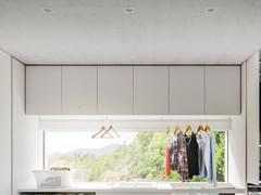 Wide laundry wall unit composition in white melamine, coupled with two side laundry columns, also part of the Wide bathroom collection