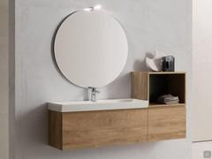 Atlantic open base unit superimposed on a drawer, a solution that does not require the use of a finishing top and creates a practical storage space at the height of the washbasin (in this case a console)