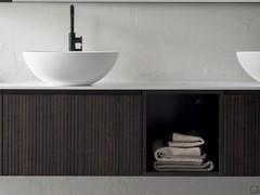 Atlantic square open base unit, sandwiched between two all-out basin units with drawer. The finish is the Laos melamine, with a particular caned effect, in its original colour (also available lacquered)