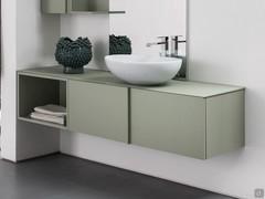 Atlantic open base unit combined with a base unit with deep drawer and all-out washbasin. The single overlapping top makes the base units part of a single seamless composition