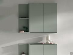 Hinged wall unit combined with open wall unit with two compartments. Matt lacquered finish