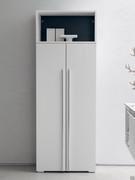 White Atlantic two-door floor-standing column, complemented by an open wall unit above to create an open storage compartment